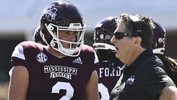 Oct 8, 2022; Starkville, Mississippi, USA; Mississippi State Bulldogs quarterback Will Rogers (2) speaks with head coach Mike Leach during a timeout during the second quarter of the game against the Arkansas Razorbacks at Davis Wade Stadium at Scott Field. Mandatory Credit: Matt Bush-USA TODAY Sports