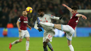 LONDON, ENGLAND - FEBRUARY 04: Declan Rice of West Ham United clears the ball from Divock Origi of Liverpool during the Premier League match between West Ham United and Liverpool FC at London Stadium on February 04, 2019 in London, United Kingdom. (Photo by Richard Heathcote/Getty Images)