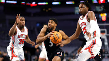 Cincinnati Bearcats guard David DeJulius goes to the basket against Houston Cougars at Dickies Arena. Getty Images.