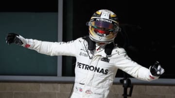 AUSTIN, TX - OCTOBER 22: Race winner Lewis Hamilton of Great Britain and Mercedes GP celebrates on the podium during the United States Formula One Grand Prix at Circuit of The Americas on October 22, 2017 in Austin, Texas. (Photo by Clive Mason/Getty Images)