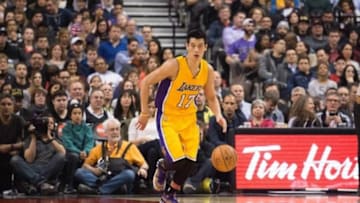 Mar 27, 2015; Toronto, Ontario, Los Angeles Lakers guard Jeremy Lin (17) takes the ball up court during the first quarter in a game against the Toronto Raptors at Air Canada Centre. The Toronto Raptors won 94-83. Mandatory Credit: Nick Turchiaro-USA TODAY Sports