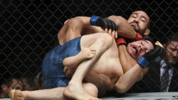 DENVER, CO - NOVEMBER 10: FS1 prelims Davi Ramos sets the rear naked choke hold to beat John Gunther in under 2 minutes in their lightweight 3 round bout during UFC Fight Night at the Pepsi Center on November 10, 2018 in Denver, Colorado. (Photo by Joe Amon/The Denver Post via Getty Images)
