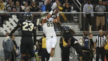ORLANDO, FL - NOVEMBER 24: Mitchell Wilcox #89 of the South Florida Bulls catches a pass for a touchdown as Shaquem Griffin #18 of the UCF Knights defends in the second quarter at Spectrum Stadium on November 24, 2017 in Orlando, Florida. (Photo by Logan Bowles/Getty Images)
