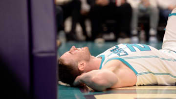 Feb 7, 2022; Charlotte, North Carolina, USA; Charlotte Hornets guard forward Gordon Hayward (20) lays injured after a hard fall during the first half against the Toronto Raptors at the Spectrum Center. Mandatory Credit: Sam Sharpe-USA TODAY Sports