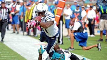 Oct 20, 2013; Jacksonville, FL, USA; San Diego Chargers wide receiver Eddie Royal (11) dives in for a touchdown past Jacksonville Jaguars safety Johnathan Cyprien (37) during the first half of the game at EverBank Field. Mandatory Credit: Melina Vastola-USA TODAY Sports
