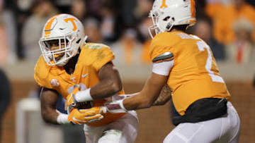 KNOXVILLE, TN - NOVEMBER 10: Ty Chandler #8 of the Tennessee Volunteers takes a hand off from Jarrett Guarantano #2 of the Tennessee Volunteers during the second half of the game between the Kentucky Wildcats and the Tennessee Volunteers at Neyland Stadium on November 10, 2018 in Knoxville, Tennessee. Tennessee won the game 24-7. (Photo by Donald Page/Getty Images)