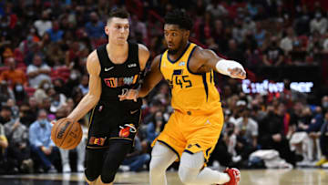 Miami Heat guard Tyler Herro (14) controls the ball against Jazz guard Donovan Mitchell (45)(Jim Rassol-USA TODAY Sports)