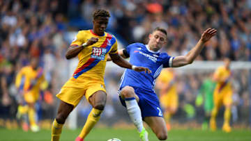 LONDON, ENGLAND - APRIL 01: Wilfried Zaha of Crystal Palace (L) is tackled by Gary Cahill of Chelsea (R) during the Premier League match between Chelsea and Crystal Palace at Stamford Bridge on April 1, 2017 in London, England. (Photo by Mike Hewitt/Getty Images)