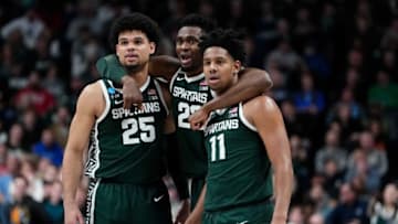 Mar 19, 2023; Columbus, Ohio, USA; Michigan State Spartans forward Malik Hall (25), center Mady Sissoko (22) and guard A.J. Hoggard (11) celebrate during the second round of the NCAA men’s basketball tournament against the Marquette Golden Eagles at Nationwide Arena. The Spartans won 69-60. Mandatory Credit: Adam Cairns-The Columbus DispatchBasketball Ncaa Men S Basketball Tournament Round 2