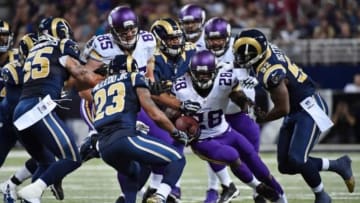 Sep 7, 2014; St. Louis, MO, USA; Minnesota Vikings running back Adrian Peterson (28) runs the ball against the St. Louis Rams during the first half at the Edward Jones Dome. Mandatory Credit: Jasen Vinlove-USA TODAY Sports