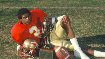 TALLAHASSEE, FL - CIRCA 1988: Defensive back Deion Sanders #2 of the Florida State Seminoles winner of the 1988 Jim Thorpe Award, poses with the trophy circa 1988 at Doak Campbell Stadium at Florida State University in Tallahassee, Florida. (Photo by Focus on Sport/Getty Images)