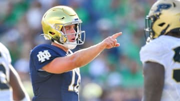 Sep 18, 2021; South Bend, Indiana, USA; Notre Dame Fighting Irish quarterback Jack Coan (17) signals in the fourth quarter against the Purdue Boilermakers at Notre Dame Stadium. Mandatory Credit: Matt Cashore-USA TODAY Sports