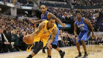 Oct 29, 2013; Indianapolis, IN, USA; Indiana Pacers guard George Hill (3) drives to the basket against Orlando Magic guard Jameer Nelson (14) during the game at Bankers Life Fieldhouse. Indiana defeats Orlando 97-87. Mandatory Credit: Brian Spurlock-USA TODAY Sports