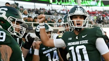 Payton Thorne, right, gets the team fired up before Michigan State's football game against Nebraska on Saturday, Sept. 25, 2021, at Spartan Stadium in East Lansing.210925 Msu Nebraska 050a