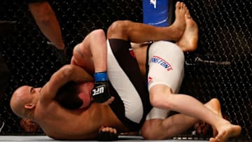 LAS VEGAS, NV - DECEMBER 12: (L-R) Warlley Alves of Brazil attempts to submit Colby Covington in their welterweight bout during the UFC 194 event inside MGM Grand Garden Arena on December 12, 2015 in Las Vegas, Nevada. (Photo by Christian Petersen/Zuffa LLC/Zuffa LLC via Getty Images)