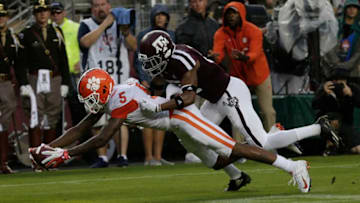 COLLEGE STATION, TX - SEPTEMBER 08: Tee Higgins #5 of the Clemson Tigers scores on a 64 yard reception in the second quarter as Charles Oliver #21 of the Texas A&M Aggies is unable to stop him at Kyle Field on September 8, 2018 in College Station, Texas. (Photo by Bob Levey/Getty Images)