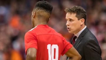 SYRACUSE, NY - NOVEMBER 10: Head coach Brian Earl of the Cornell Big Red speaks with Matt Morgan #10 during the first half against the Syracuse Orange at the Carrier Dome on November 10, 2017 in Syracuse, New York. (Photo by Brett Carlsen/Getty Images)