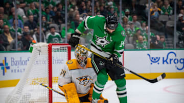 Nov 10, 2021; Dallas, Texas, USA; Dallas Stars left wing Jamie Benn (14) screens Nashville Predators goaltender Juuse Saros (74) during the second period at the American Airlines Center. Mandatory Credit: Jerome Miron-USA TODAY Sports