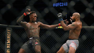 LAS VEGAS, NEVADA - MARCH 07: Israel Adesanya reacts to a punch from Yoel Romero in a Adesanya decision win to retain the middleweight title at T-Mobile Arena on March 07, 2020 in Las Vegas, Nevada. (Photo by Harry How/Getty Images)