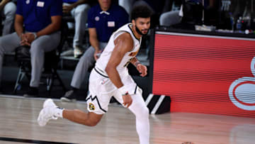 LAKE BUENA VISTA, FLORIDA - SEPTEMBER 05: Jamal Murray #27 of the Denver Nuggets dribbles the ball during the first quarter against the LA Clippers in Game Two of the Western Conference Second Round during the 2020 NBA Playoffs at AdventHealth Arena at the ESPN Wide World Of Sports Complex on September 05, 2020 in Lake Buena Vista, Florida. NOTE TO USER: User expressly acknowledges and agrees that, by downloading and or using this photograph, User is consenting to the terms and conditions of the Getty Images License Agreement. (Photo by Douglas P. DeFelice/Getty Images)