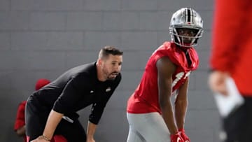 Mar 7, 2023; Columbus, Ohio, USA; Ohio State Buckeyes wide receiver Carnell Tate lines up beside offensive coordinator Brian Hartline during spring football drills at the Woody Hayes Athletic Center. Mandatory Credit: Adam Cairns-The Columbus DispatchFootball Ohio State Buckeyes Football