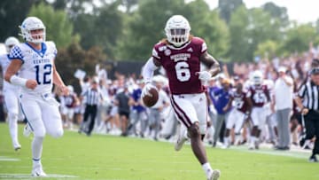 STARKVILLE, MS - SEPTEMBER 21: Linebacker Willie Gay Jr. #6 of the Mississippi State Bulldogs runs the ball in for a touchdown in front of quarterback Sawyer Smith #12 of the Kentucky Wildcats during the first quarter at Davis Wade Stadium on September 21, 2019 in Starkville, Mississippi. (Photo by Michael Chang/Getty Images)