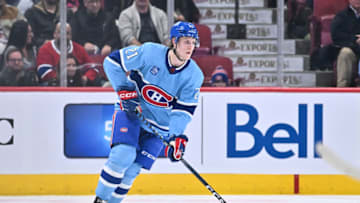 MONTREAL, CANADA - DECEMBER 10: Kaiden Guhle #21 of the Montreal Canadiens skates the puck during the second period against the Los Angeles Kings at Centre Bell on December 10, 2022 in Montreal, Quebec, Canada. The Los Angeles Kings defeated the Montreal Canadiens 4-2. (Photo by Minas Panagiotakis/Getty Images)