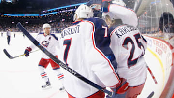 NEW YORK, NY - JANUARY 12: William Karlsson #25 of the Columbus Blue Jackets celebrates his first period goal with Jack Johnson #7 against the New York Islanders during their game at the Barclays Center on January 12, 2016 in New York City. (Photo by Al Bello/Getty Images)