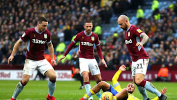 BIRMINGHAM, ENGLAND - DECEMBER 23: Kemar Roofe of Leeds United is tackled by Alan Hutton of Aston Villa inside the box during the Sky Bet Championship match between Aston Villa and Leeds United at Villa Park on December 23, 2018 in Birmingham, England. (Photo by Catherine Ivill/Getty Images)