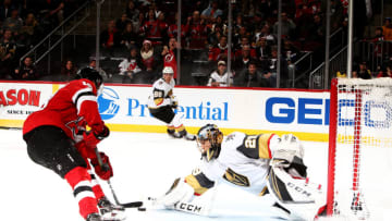 NEWARK, NEW JERSEY - DECEMBER 14: Nico Hischier #13 of the New Jersey Devils scores the winning overtime goal against Marc-Andre Fleury #29 of the Vegas Golden Knights for a 5-4 victory during their game at the Prudential Center on December 14, 2018 in Newark, New Jersey. (Photo by Al Bello/Getty Images)