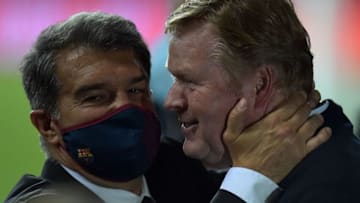 Barcelona's Dutch coach Ronald Koeman (R) celebrates with club president Joan Laporta. (Photo by CRISTINA QUICLER/AFP via Getty Images)