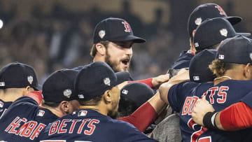 LOS ANGELES, CA - OCTOBER 28: Members of the Boston Red Sox react after the final out was recorded to win the 2018 World Series in game five against the Los Angeles Dodgers on October 28, 2018 at Dodger Stadium in Los Angeles, California. (Photo by Billie Weiss/Boston Red Sox/Getty Images)