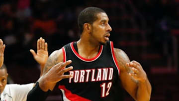 Nov 24, 2014; Philadelphia, PA, USA; Portland Trail Blazers forward LaMarcus Aldridge (12) reacts after hitting a three pointer against the Philadelphia 76ers during the second half at the Wells Fargo Center. The Trail Blazers defeated the 76ers 114-104. Mandatory Credit: Bill Streicher-USA TODAY Sports