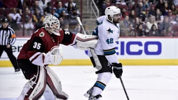 Jan 21, 2016; Glendale, AZ, USA; San Jose Sharks right wing Joel Ward (42) screens Arizona Coyotes goalie Louis Domingue (35) during the third period at Gila River Arena. Mandatory Credit: Matt Kartozian-USA TODAY Sports