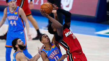 Heat center Bam Adebayo (13) is fouled by OKC Thunder guard Theo Maledon : Alonzo Adams-USA TODAY Sports