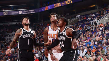 PHOENIX, AZ - NOVEMBER 6: D'Angelo Russell #1 and Rondae Hollis-Jefferson #24 of the Brooklyn Nets box out Marquese Chriss #0 of the Phoenix Suns on November 6, 2017 at Talking Stick Resort Arena in Phoenix, Arizona. NOTE TO USER: User expressly acknowledges and agrees that, by downloading and or using this photograph, user is consenting to the terms and conditions of the Getty Images License Agreement. Mandatory Copyright Notice: Copyright 2017 NBAE (Photo by Michael Gonzales/NBAE via Getty Images)
