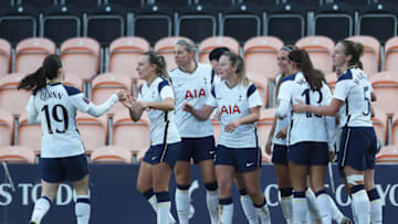 BARNET, ENGLAND - DECEMBER 06: Angela Addison of Tottenham Hotspur (obscured) celebrates with teammates after scoring her team's second goal during the Barclays FA Women's Super League match between Tottenham Hotspur Women and Brighton & Hove Albion Women at The Hive on December 06, 2020 in Barnet, England. A limited number of fans are welcomed back to stadiums to watch elite football across England. This was following easing of restrictions on spectators in tiers one and two areas only. (Photo by Naomi Baker/Getty Images)