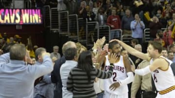 Jan 28, 2015; Cleveland, OH, USA; Cleveland Cavaliers guard Kyrie Irving (2) is congratulated by guard Matthew Dellavedova (8) after Irving