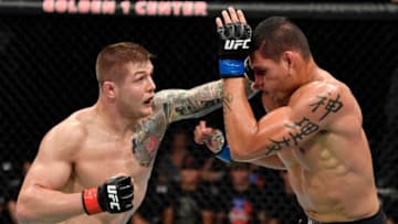 SACRAMENTO, CALIFORNIA - JULY 13: (L-R) Marvin Vettori of Italy punches Cezar Ferreira of Brazil in their middleweight bout during the UFC Fight Night event at Golden 1 Center on July 13, 2019 in Sacramento, California. (Photo by Jeff Bottari/Zuffa LLC/Zuffa LLC via Getty Images)