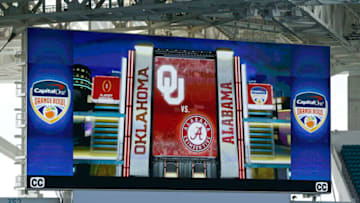 MIAMI GARDENS, FL - DECEMBER 29: One of the corner scoreboards shows the game matchup prior to the College Football Playoff Semifinal at the Capital One Orange Bowl between the Alabama Crimson Tide and the Oklahoma Sooners at Hard Rock Stadium on December 29, 2017 in Miami Gardens, Florida. Alabama defeated Oklahoma 45-34. (Photo by Joel Auerbach/Getty Images)