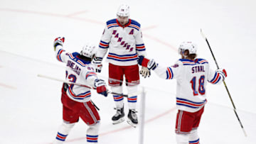 SAN JOSE, CALIFORNIA - DECEMBER 12: Chris Kreider #20 and Marc Staal #18 celebrate with Mika Zibanejad #93 of the New York Rangers after Zibanejad scored a goal against the San Jose Sharks at SAP Center on December 12, 2019 in San Jose, California. (Photo by Ezra Shaw/Getty Images)