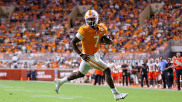 Sep 2, 2021; Knoxville, Tennessee, USA; Tennessee Volunteers quarterback Joe Milton III (7) runs for a touchdown against the Bowling Green Falcons during the second half at Neyland Stadium. Mandatory Credit: Randy Sartin-USA TODAY Sports
