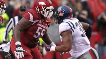 Nov 22, 2014; Fayetteville, AR, USA; Arkansas Razorbacks offensive lineman Denver Kirkland (55) during the game against the Ole Miss Rebels at Donald W. Reynolds Razorback Stadium. Arkansas defeated Mississippi 30-0. Mandatory Credit: Nelson Chenault-USA TODAY Sports