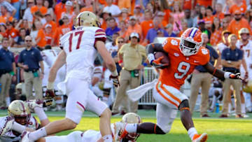 CLEMSON, SC - SEPTEMBER 23: Running back Travis Etienne #9 of the Clemson Tigers breaks away from defenders from the Boston College Eagles for a touchdown at Memorial Stadium on September 23, 2017 in Clemson, South Carolina. (Photo by Todd Bennett/Getty Images)