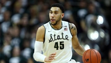 Feb 18, 2016; East Lansing, MI, USA; Michigan State Spartans guard Denzel Valentine (45) brings the ball up court during the second half of a game against the Wisconsin Badgers at Jack Breslin Student Events Center. Mandatory Credit: Mike Carter-USA TODAY Sports