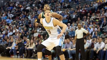 Nov 11, 2015; Denver, CO, USA; Denver Nuggets center Nikola Jokic (15) and Milwaukee Bucks forward Giannis Antetokounmpo (34) battle for position during the second half at Pepsi Center. The Nuggets won 103-102. Mandatory Credit: Chris Humphreys-USA TODAY Sports