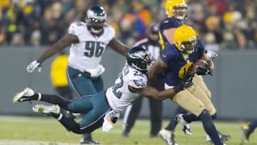 Nov 16, 2014; Green Bay, WI, USA; Green Bay Packers wide receiver Randall Cobb (18) is tackled by Philadelphia Eagles cornerback Brandon Boykin (22) after catching a pass during the second quarter at Lambeau Field. Green Bay won 53-20. Mandatory Credit: Jeff Hanisch-USA TODAY Sports