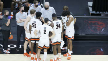 Jan 2, 2021; Corvallis, Oregon, USA; Oregon State Beavers head coach Wayne Tinkle (top center) talks to his players during a timeout against the California Golden Bears at Gill Coliseum. Mandatory Credit: Soobum Im-USA TODAY Sports