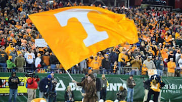 Dec 30, 2016; Nashville , TN, USA; Tennessee Volunteers cheerleaders do push ups and wave a flag after a touchdown during the second half against the Nebraska Cornhuskers at Nissan Stadium. Mandatory Credit: Jim Brown-USA TODAY Sports