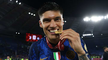 ROME, ITALY - MAY 11: Joaquin Correa of FC Internazionale bites his winners' medal as he celebrates following the 4-2 victory in the Coppa Italia Final match between Juventus and FC Internazionale at Stadio Olimpico on May 11, 2022 in Rome, Italy. (Photo by Jonathan Moscrop/Getty Images)